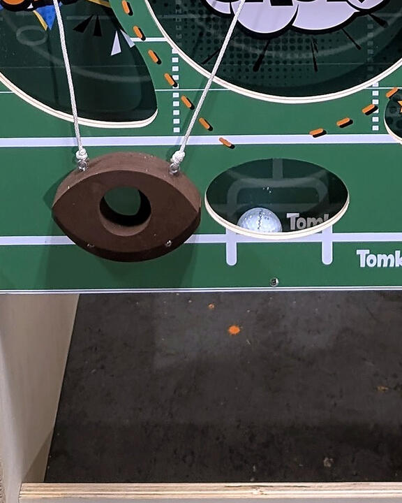 Ball-lift bar and lower scoring holes, close-up
